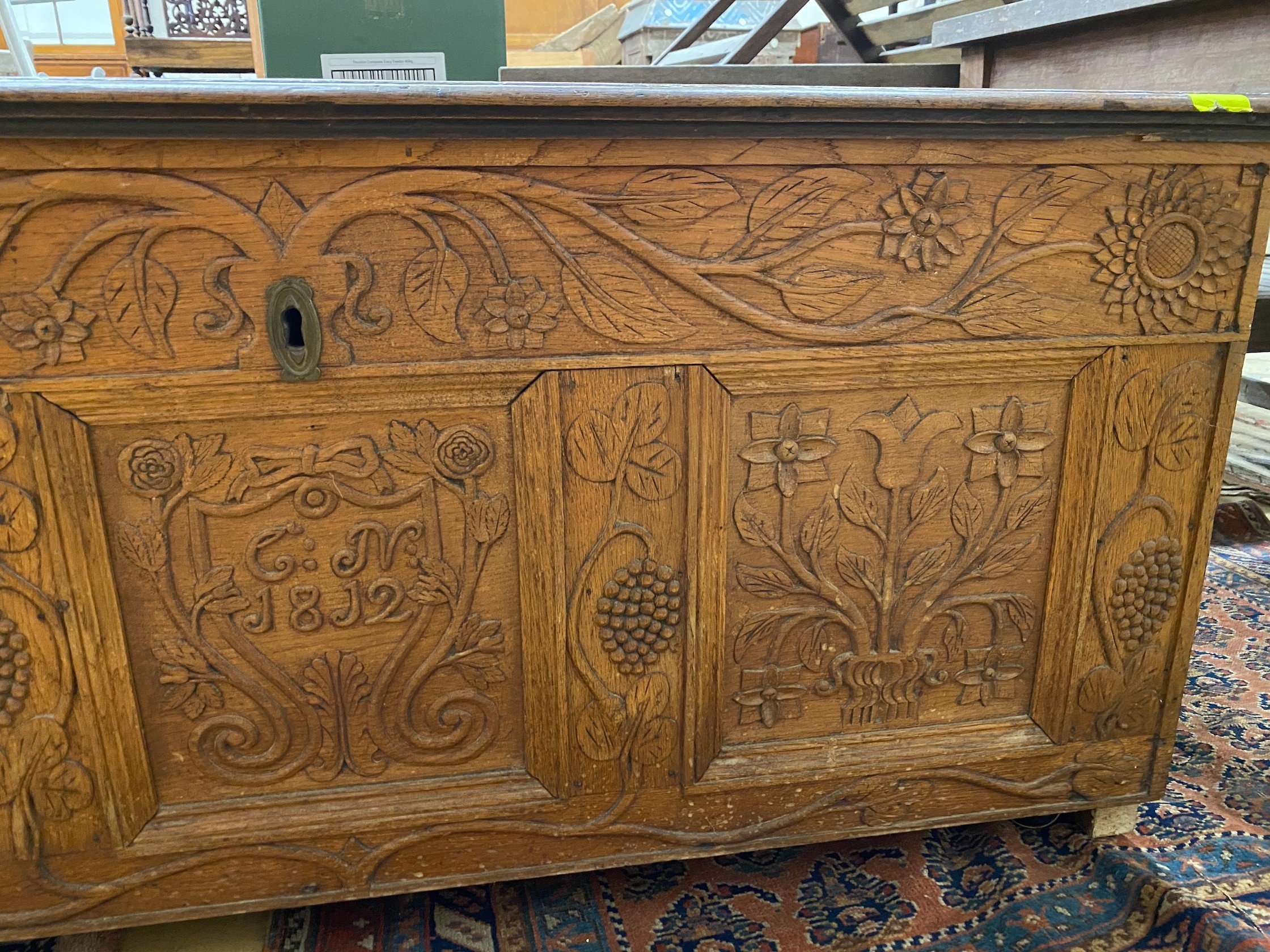 An 18th century and later carved oak coffer, length 134cm, depth 56cm, height 61cm
